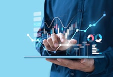 man using ipad with reporting data icons superimposed over top