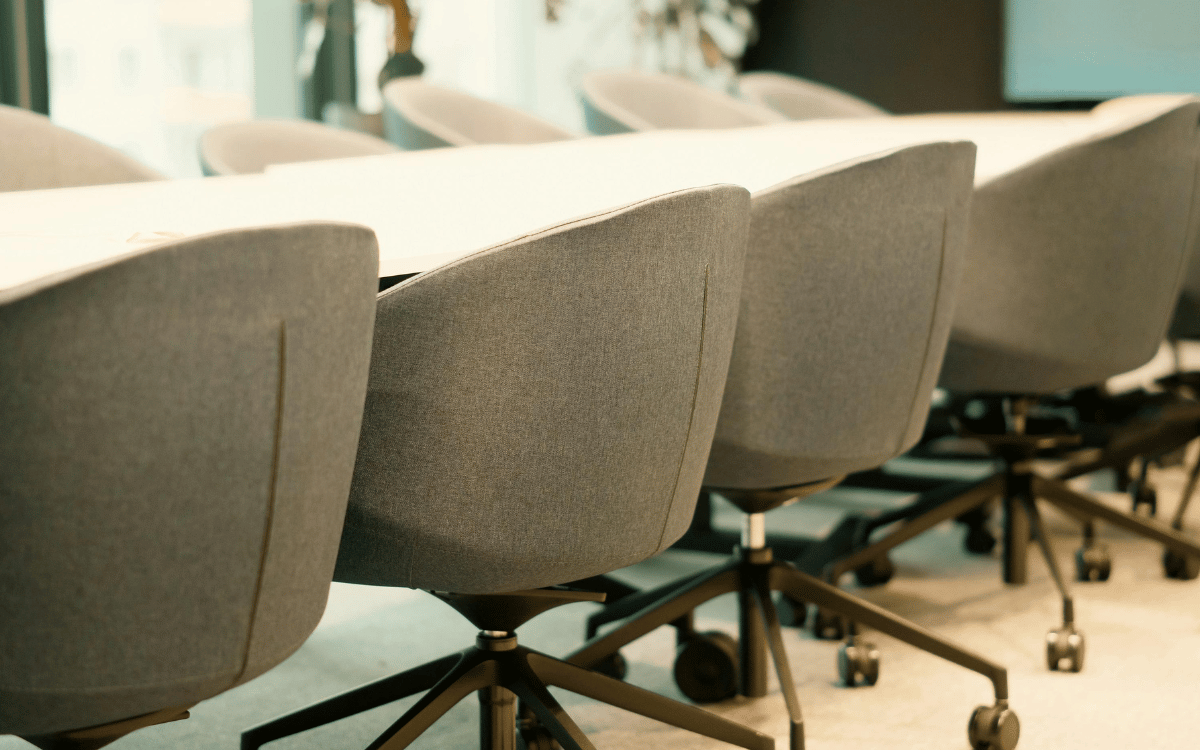 Empty office chairs in a boardroom